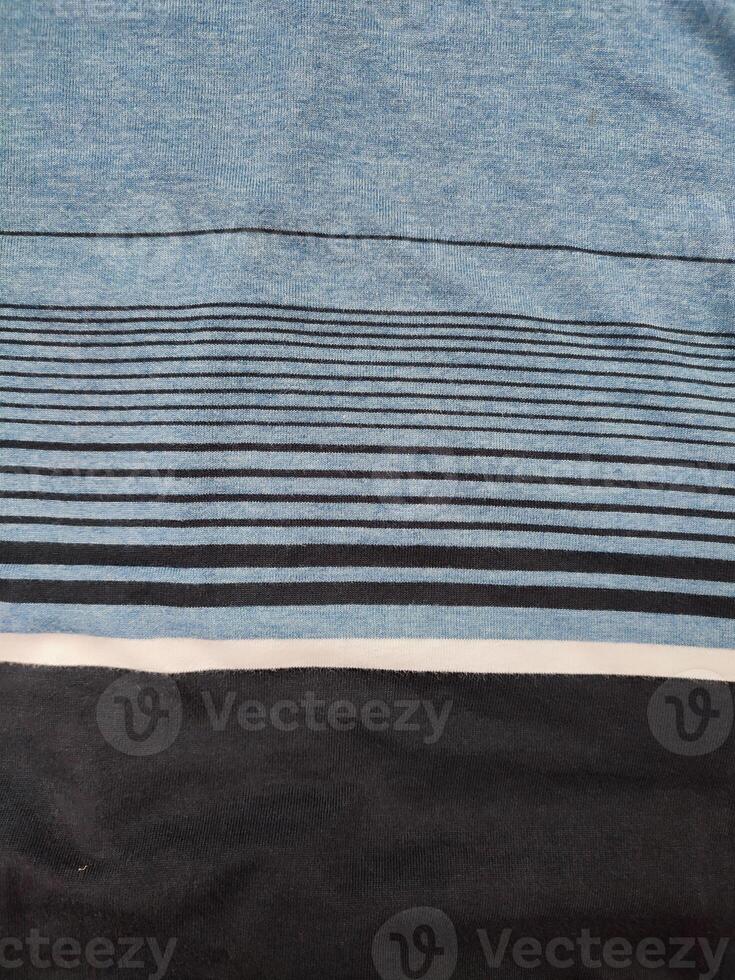 fabric texture with black, white and blue striped patterns photo