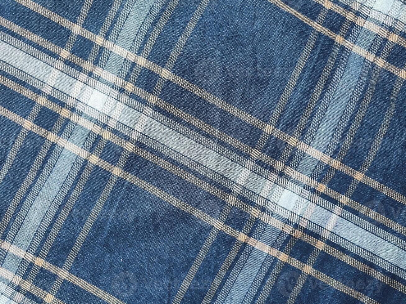 The texture of the shirt fabric has a checkered pattern photo