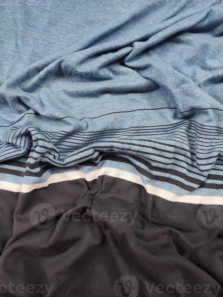 fabric texture with black, white and blue striped patterns photo