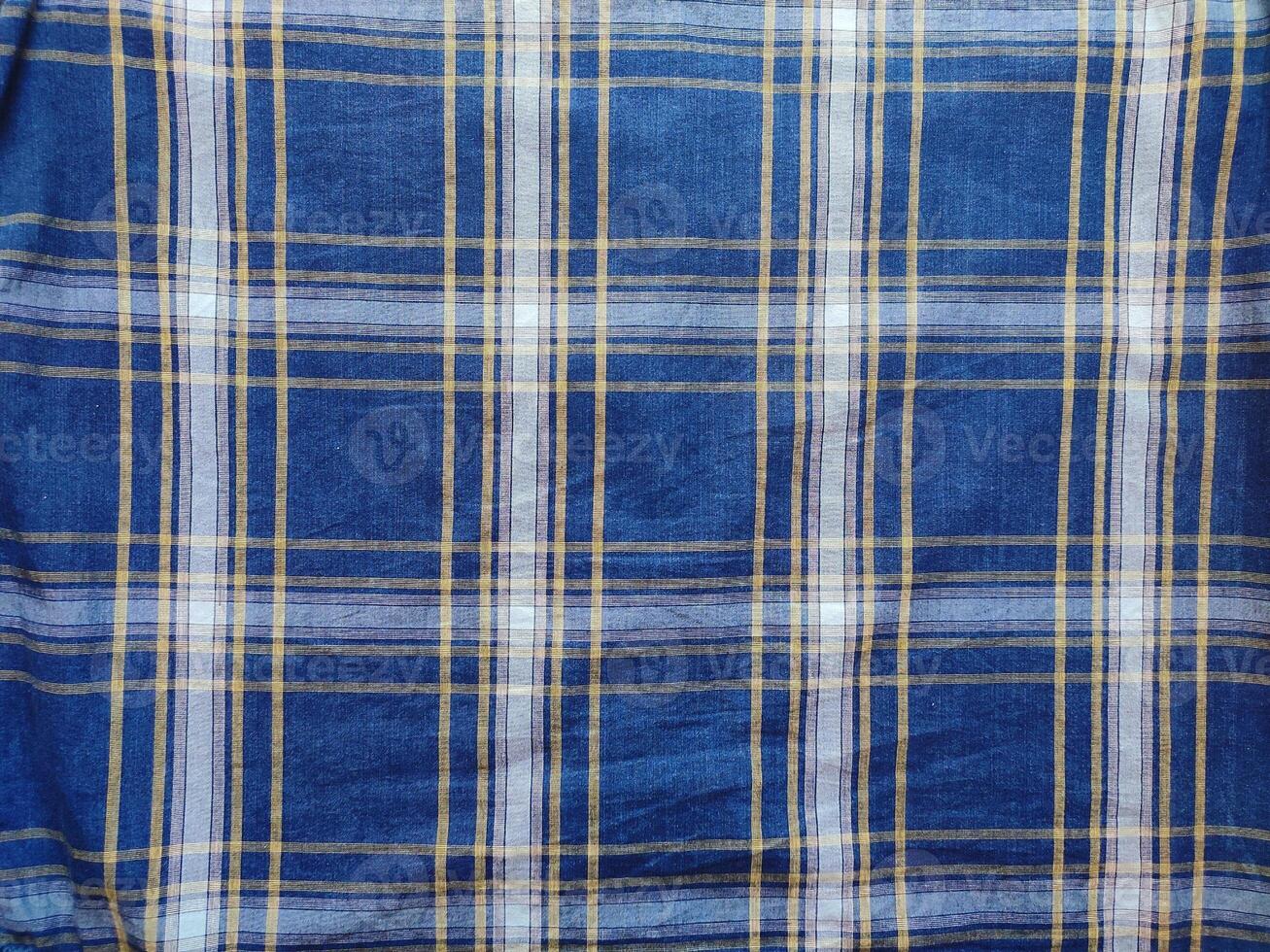 The texture of the shirt fabric has a checkered pattern photo