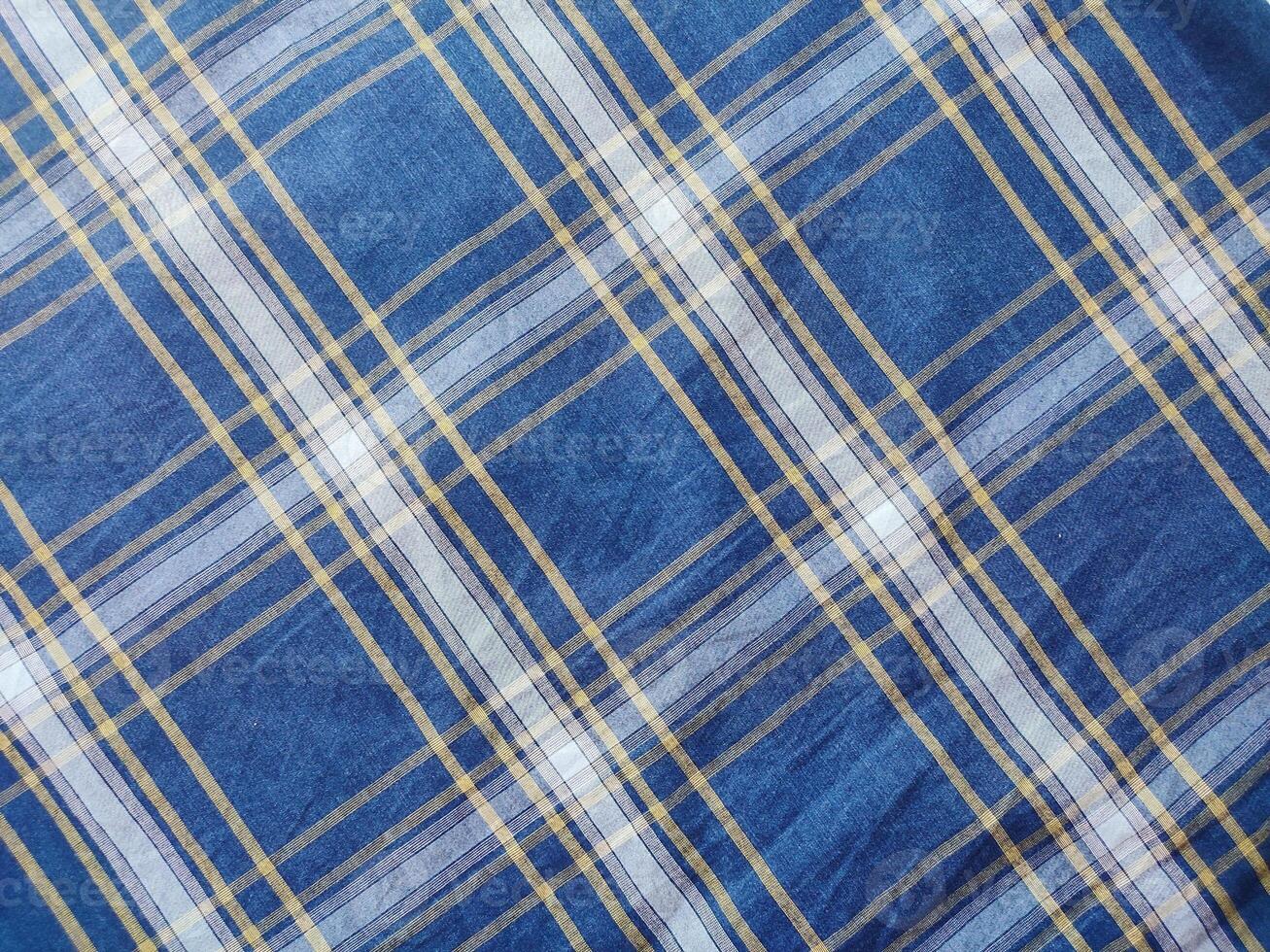 The texture of the shirt fabric has a checkered pattern photo