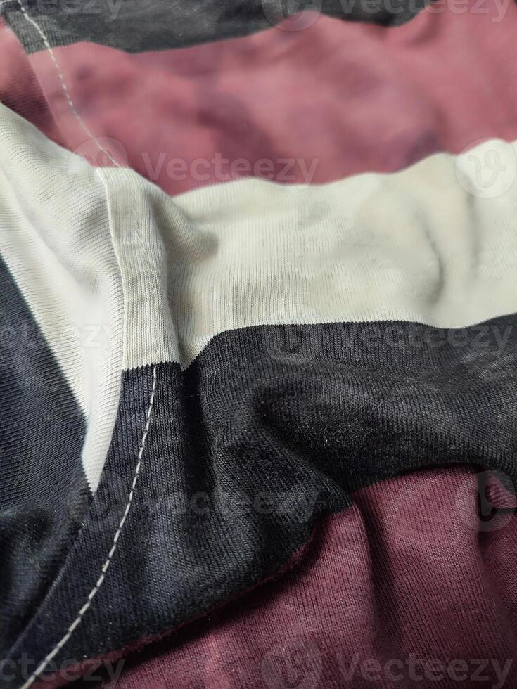 dirty white, black and red cloth at the bottom and filled with dust photo