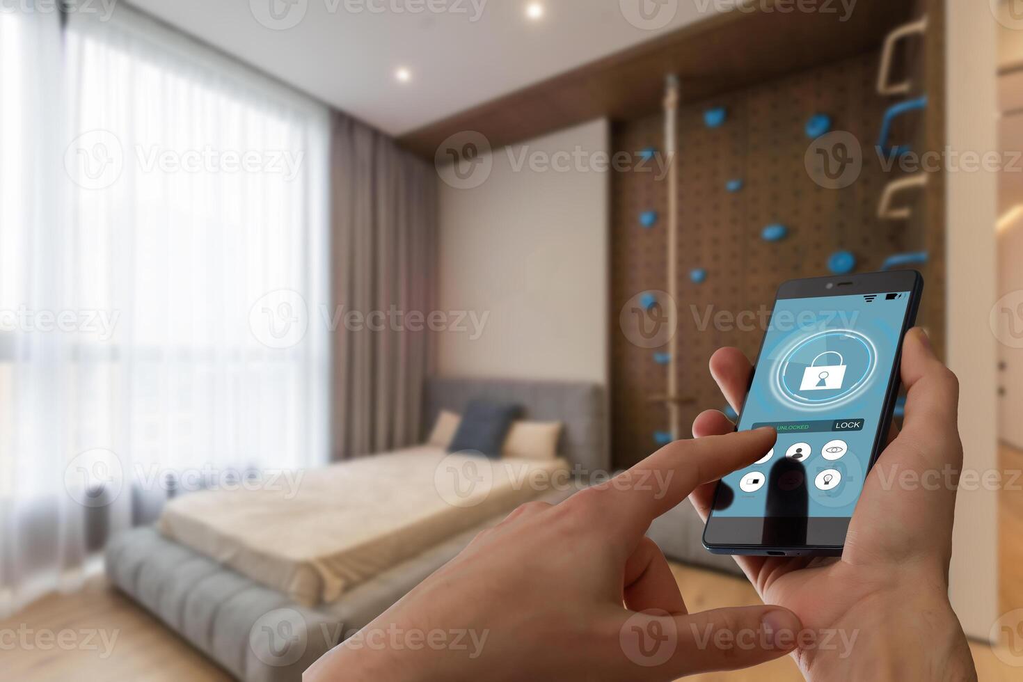 Smart home automation app on smartphone hold by female hand with home interior in background photo