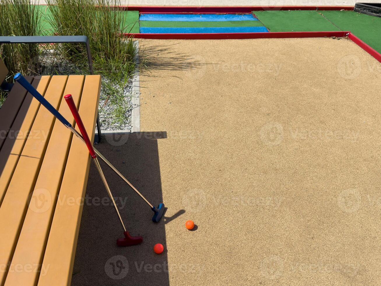 Closeup of player play mini golf with ball photo