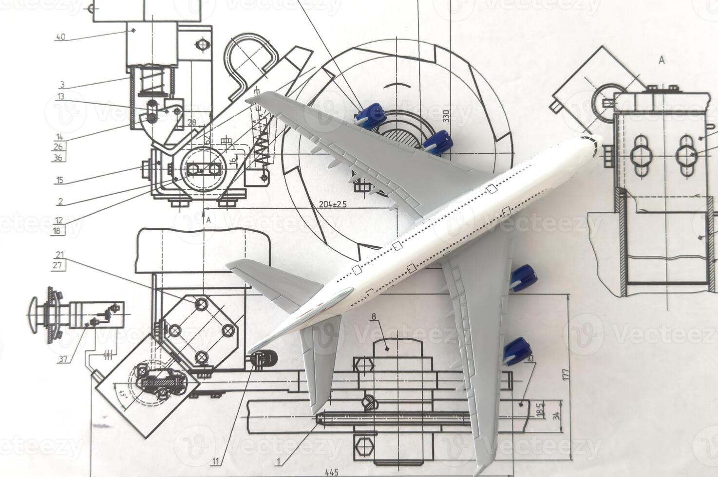 Image of passenger airplane and engineering blueprint photo