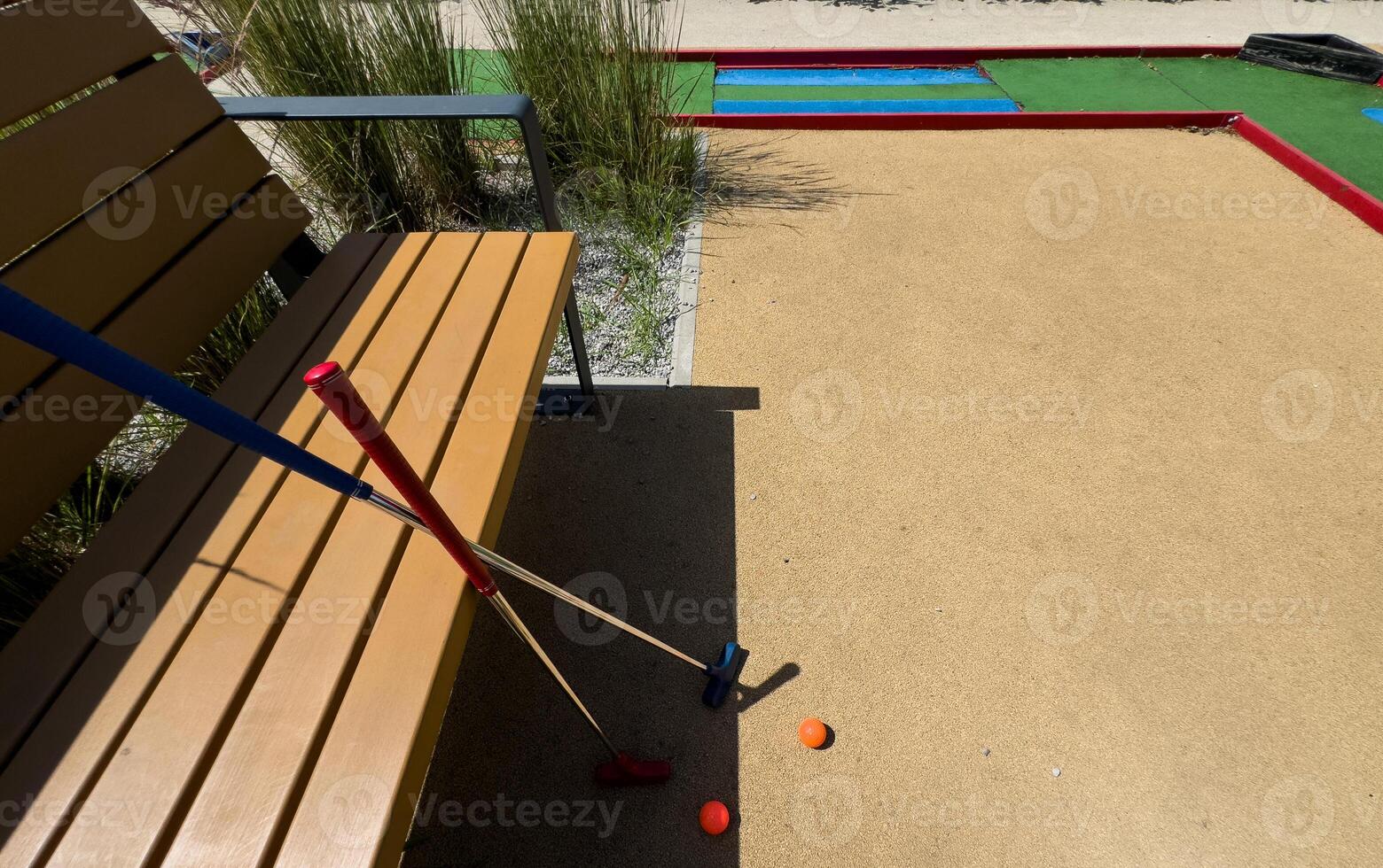 Closeup of player play mini golf with ball photo