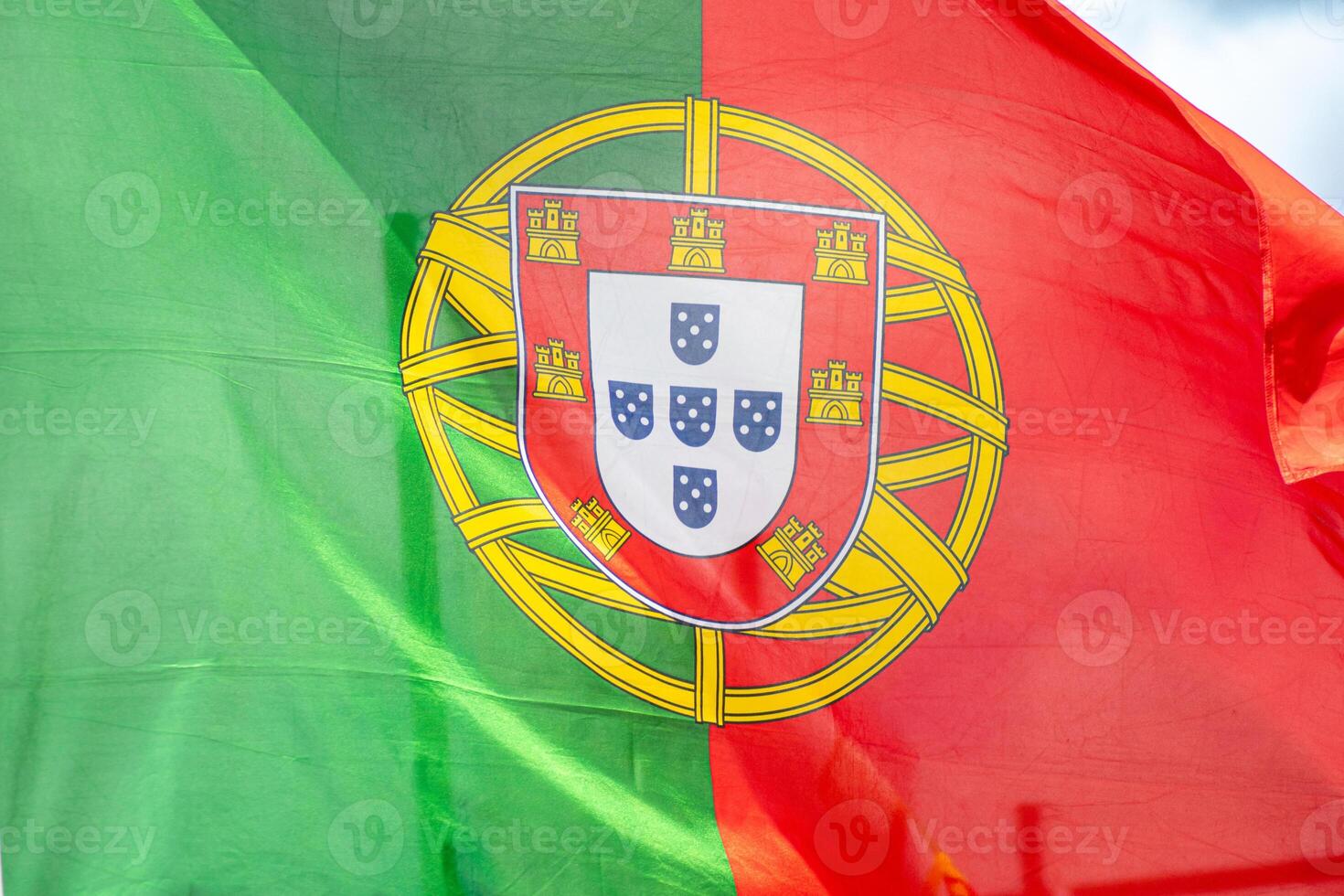 close-up view of a portuguese flag fluttering in the wind photo