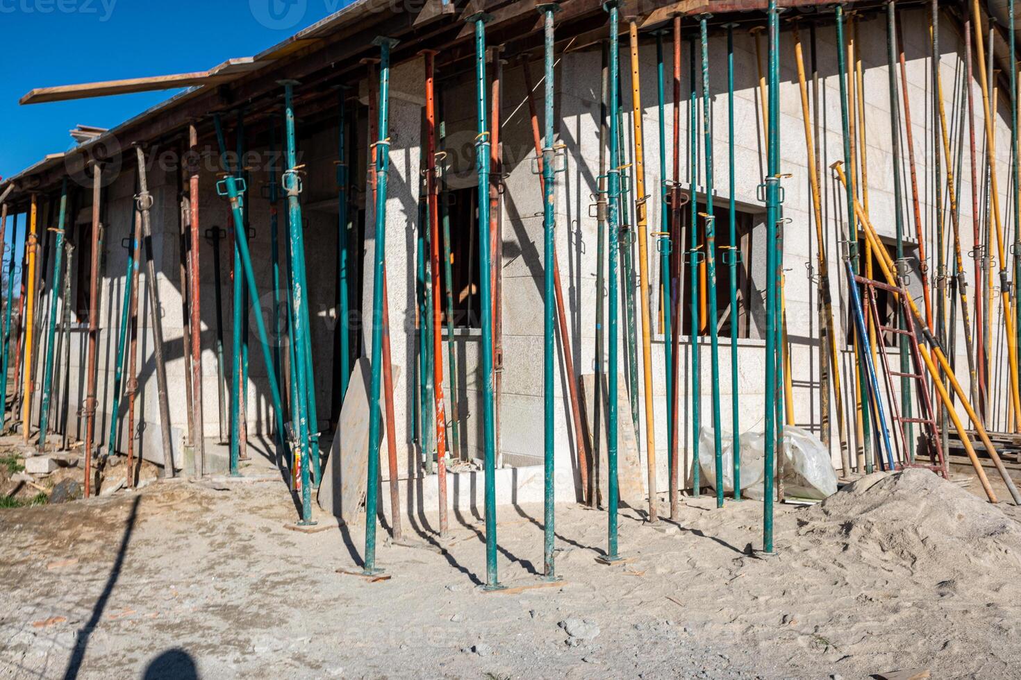 view of a granite stone house under construction photo