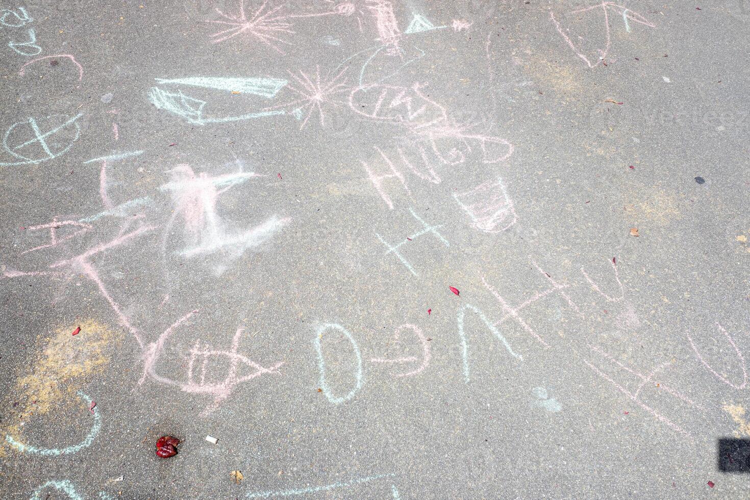 children's drawings on the floor of a school backyard photo