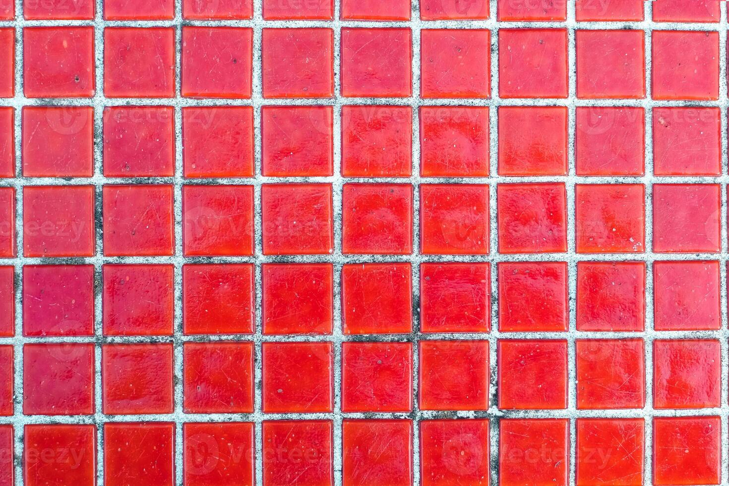 Texture of red mosaic tiles, close-up photo
