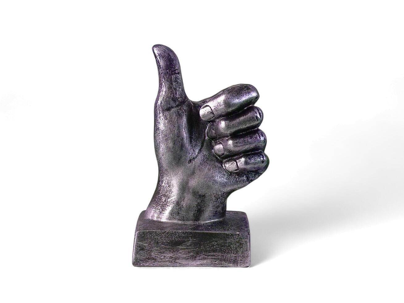 silver hand decoration with a thumbs up on a white background photo