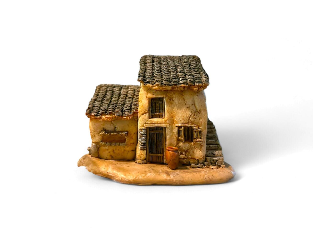 house made from matches on white background photo