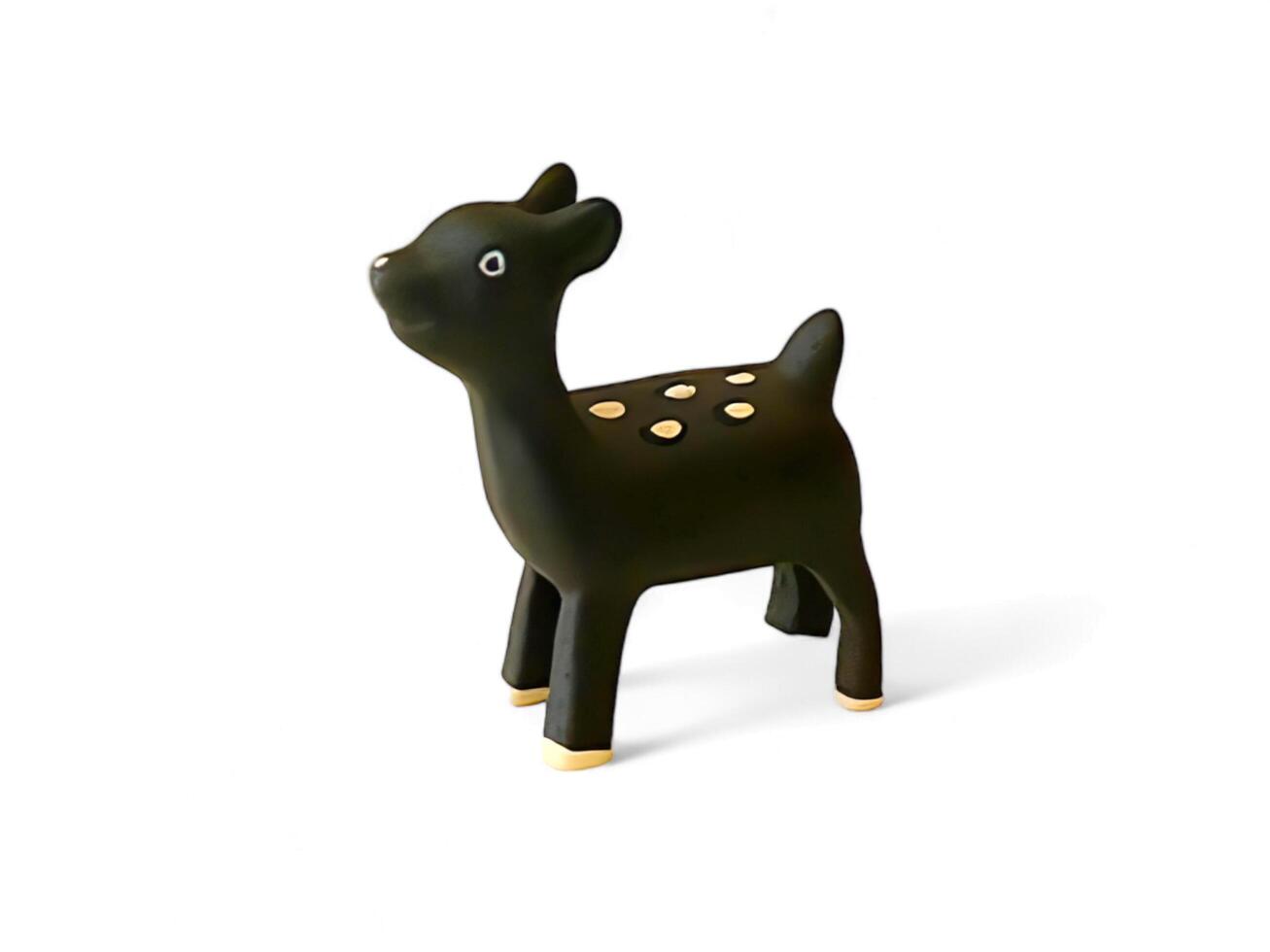 wooden miniature of a black mouse deer on a white background photo