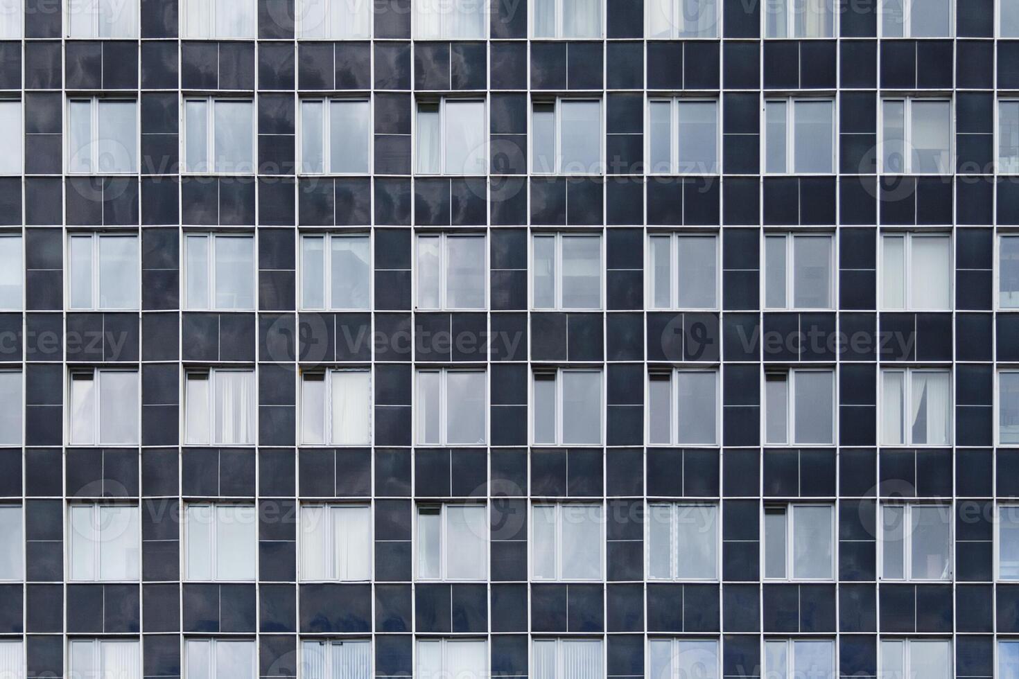 Front view on a facade of modern office building as texture, background, abstract photo