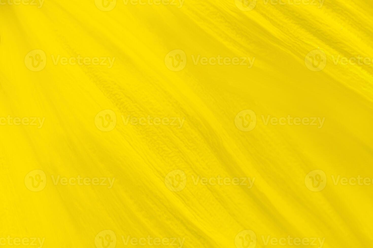 Close up view on a petal of yellow sunflower as background, texture photo