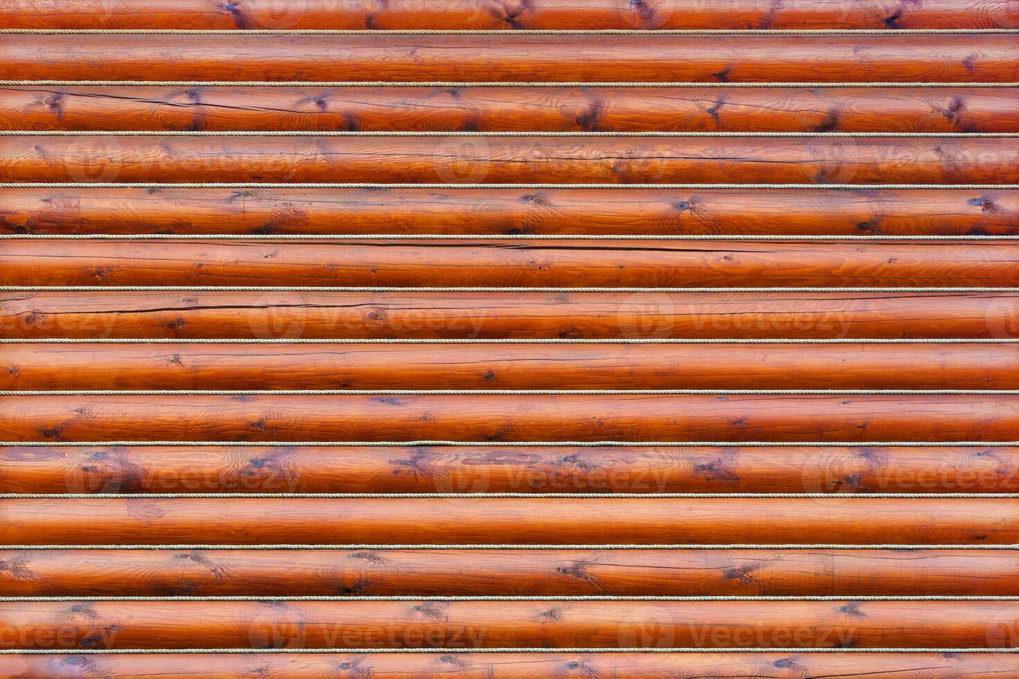 Brown wooden wall from horizontal logs as texture, background photo