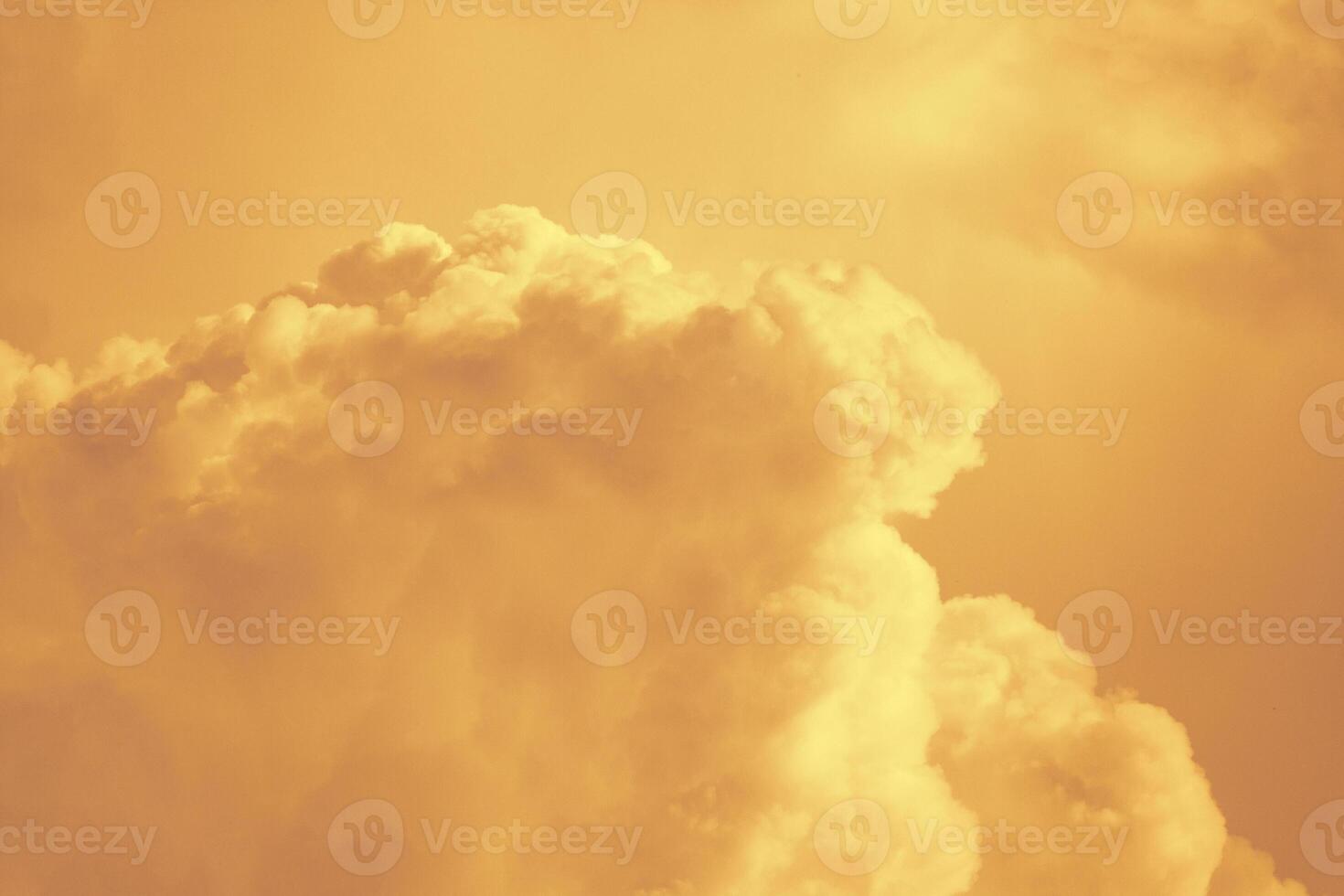 Orange fluffy clouds as background photo