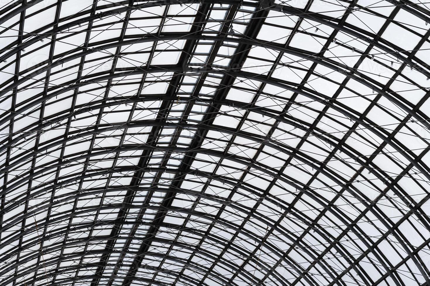 Abstract view to hemispherical ceiling of glass and metal in modern building as background, texture photo