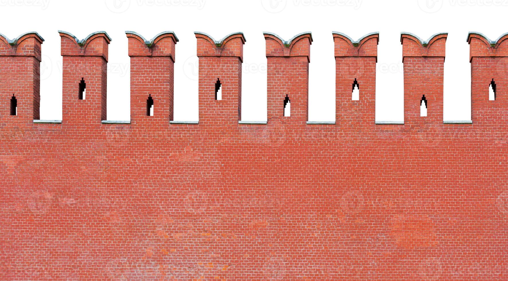 Close up view on a fragment of red brick wall with a dovetail-shaped merlon battlement, isolated on a white background photo