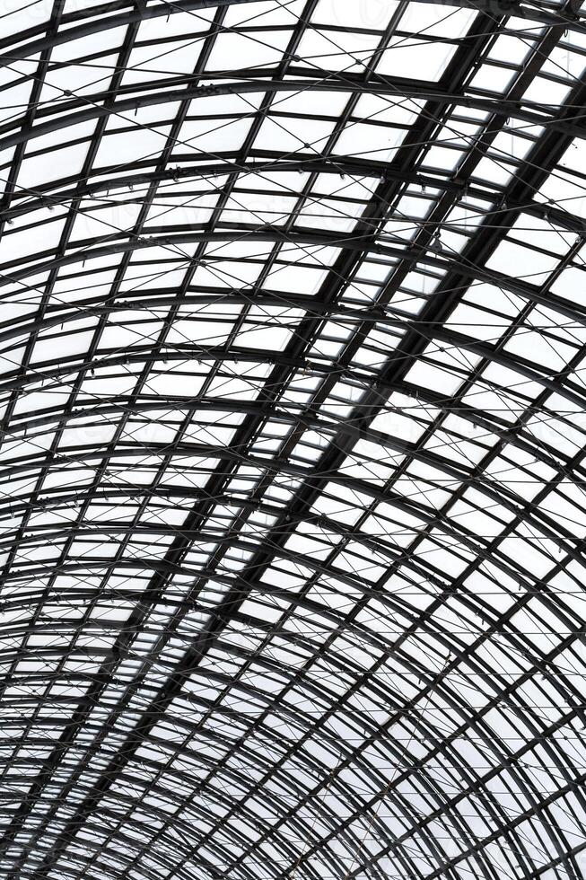 Perspective view to semispherical ceiling of glass and metal in modern building as background, texture photo