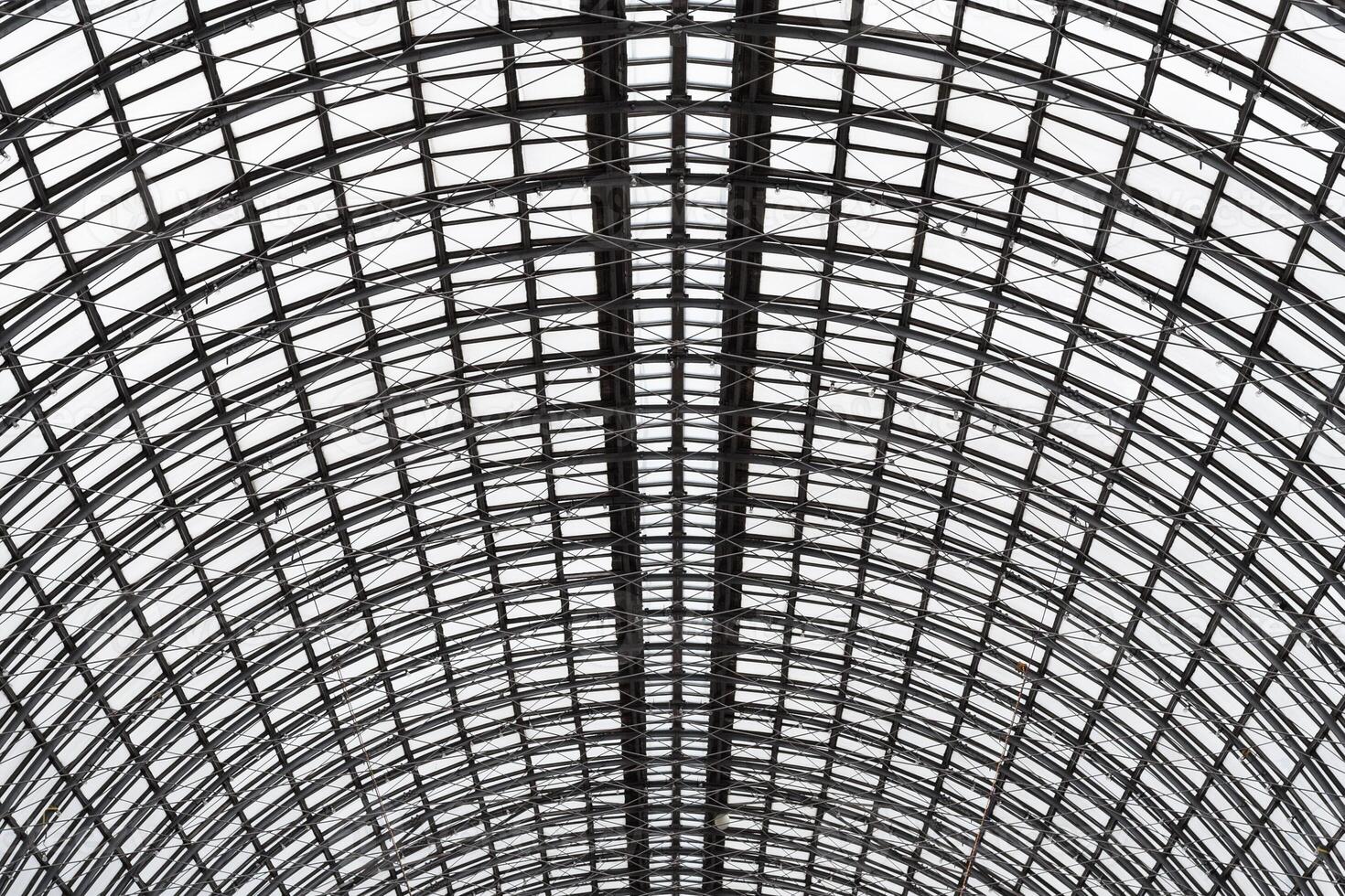 Wide angled view to hemispherical ceiling of glass and metal in modern building as background, texture photo