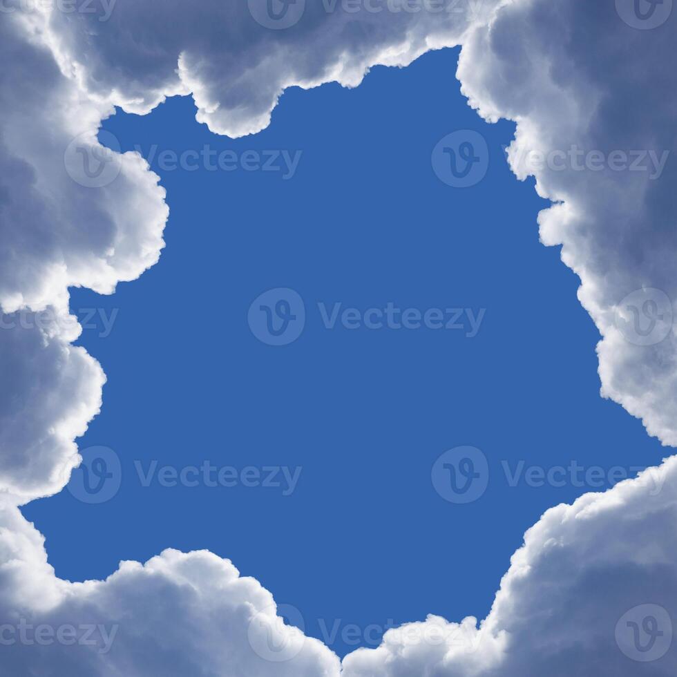 Framing from the fluffy clouds with highlighted edges in the blue sky with copy space photo