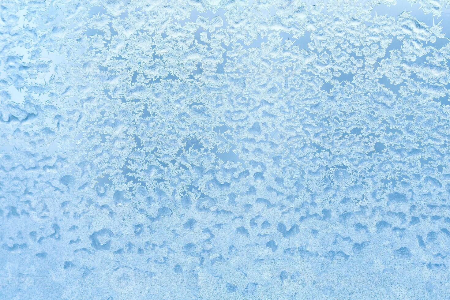 Azure frosty pattern on the glass as background. Abstract, copy space, texture photo