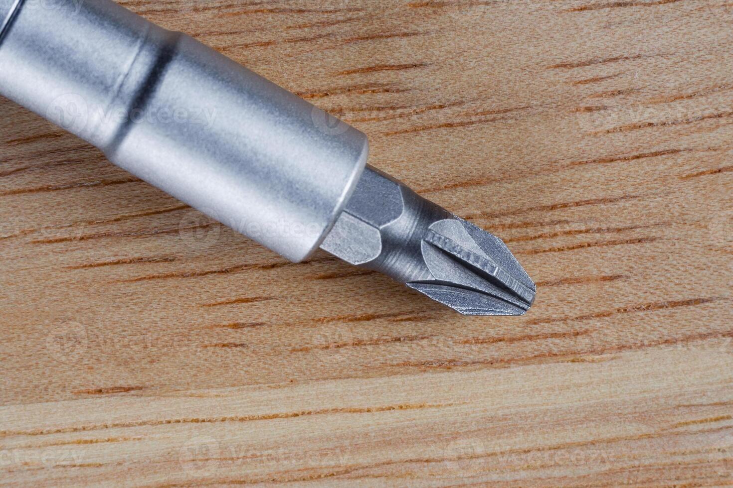 Screwdriver on a wooden table. Close up photo