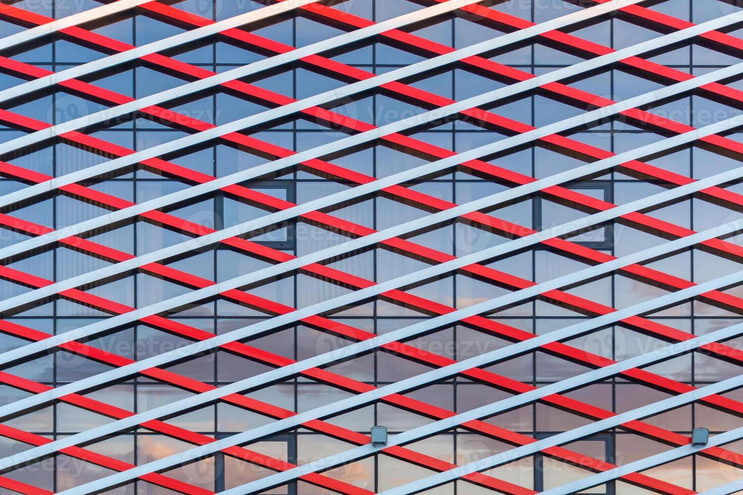 Front view of a fragment of modern building of glass and metal as texture photo
