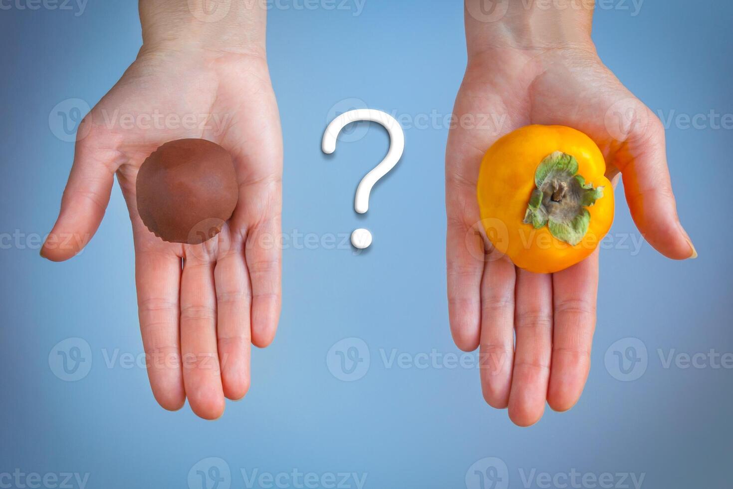 Choosing between chocolate cake and persimmons photo