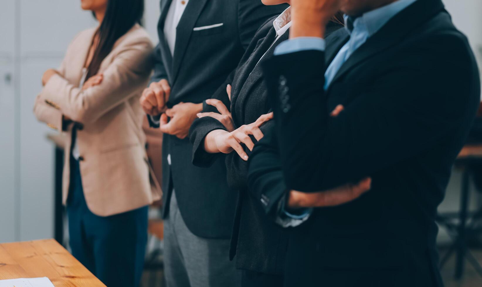Motivated successful business team giving high five, happy young students employees group join hands with senior teacher mentor, team building unity concept, help support in teamwork, close up view photo
