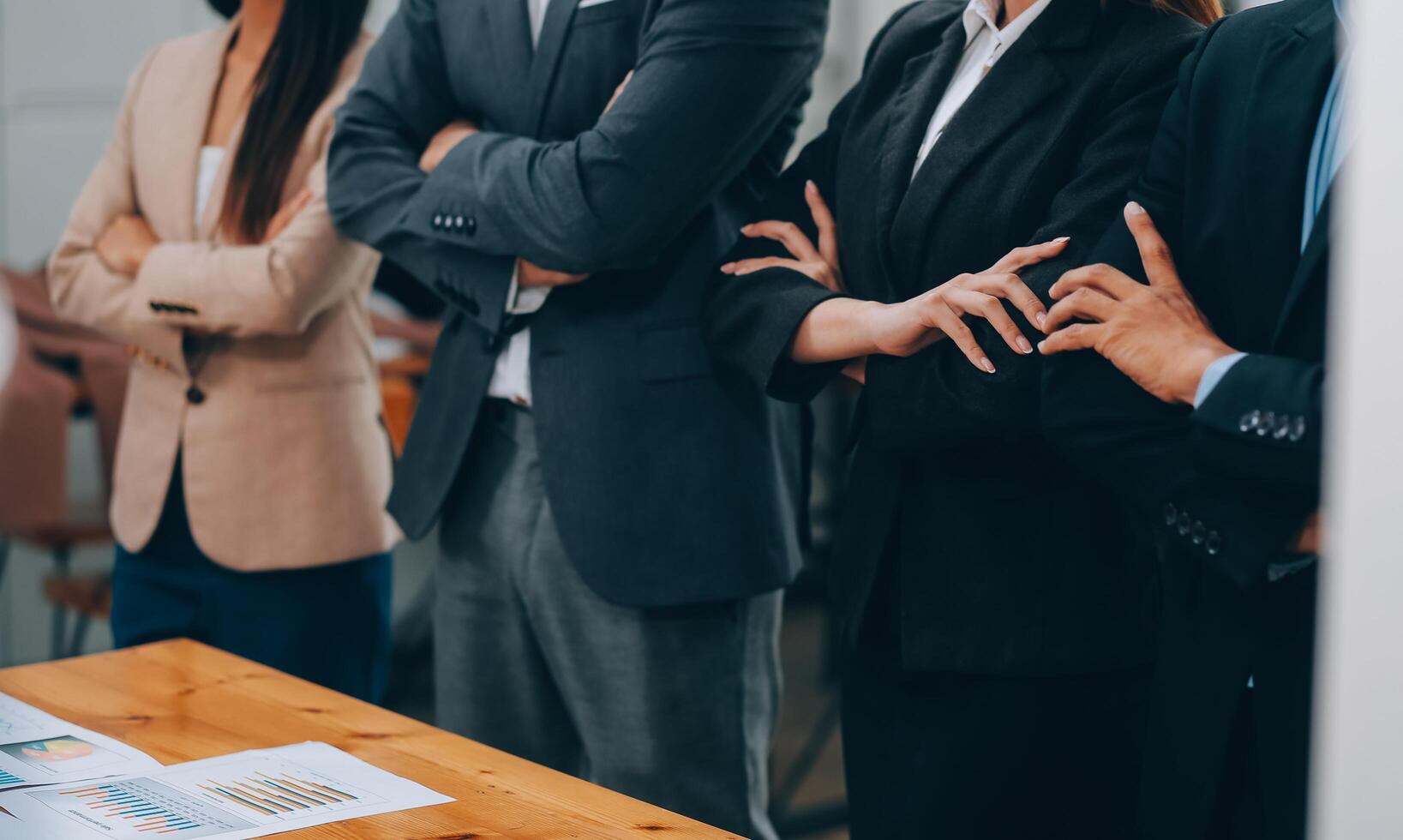 Motivated successful business team giving high five, happy young students employees group join hands with senior teacher mentor, team building unity concept, help support in teamwork, close up view photo