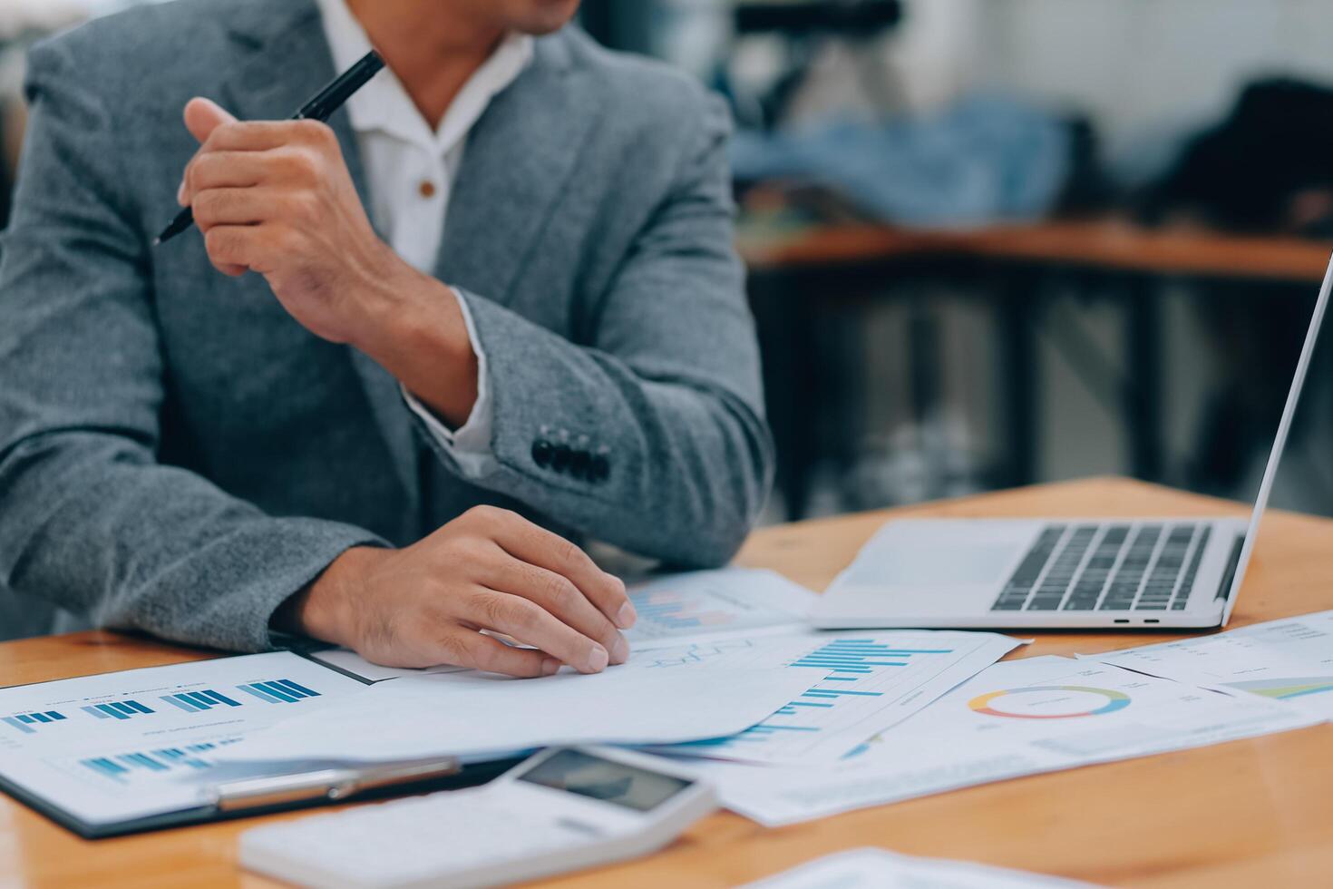 Young Businesspeople Working with Laptop in Modern Office. Office Workers at Work. Communication and Discussion at Work Concepts. Business Concept. Businessman and Businesswoman Concepts. photo