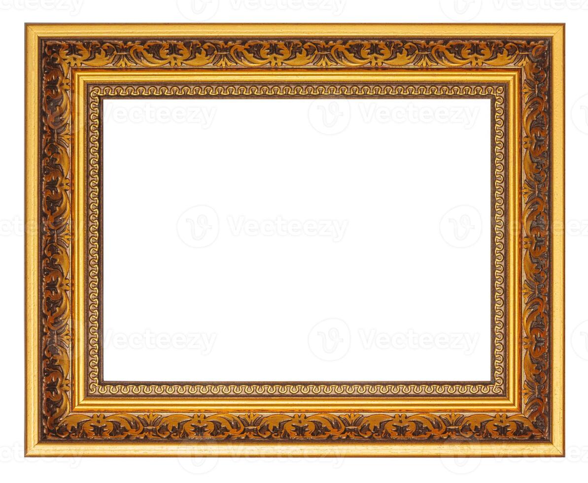 Golden picture frame with carved pattern isolated on a white background photo