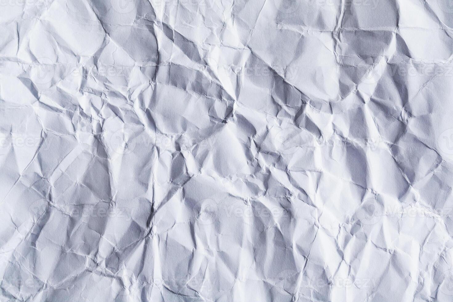 A sheet of white blank crumpled paper as background, texture photo
