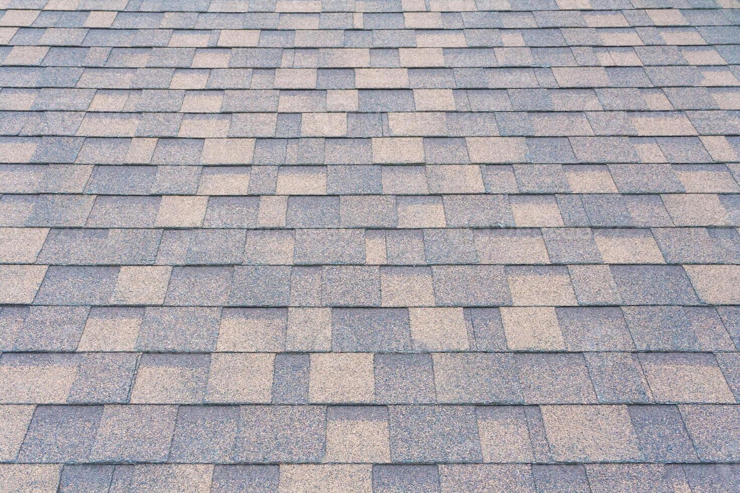 Perspective view on a shingles on the roof photo