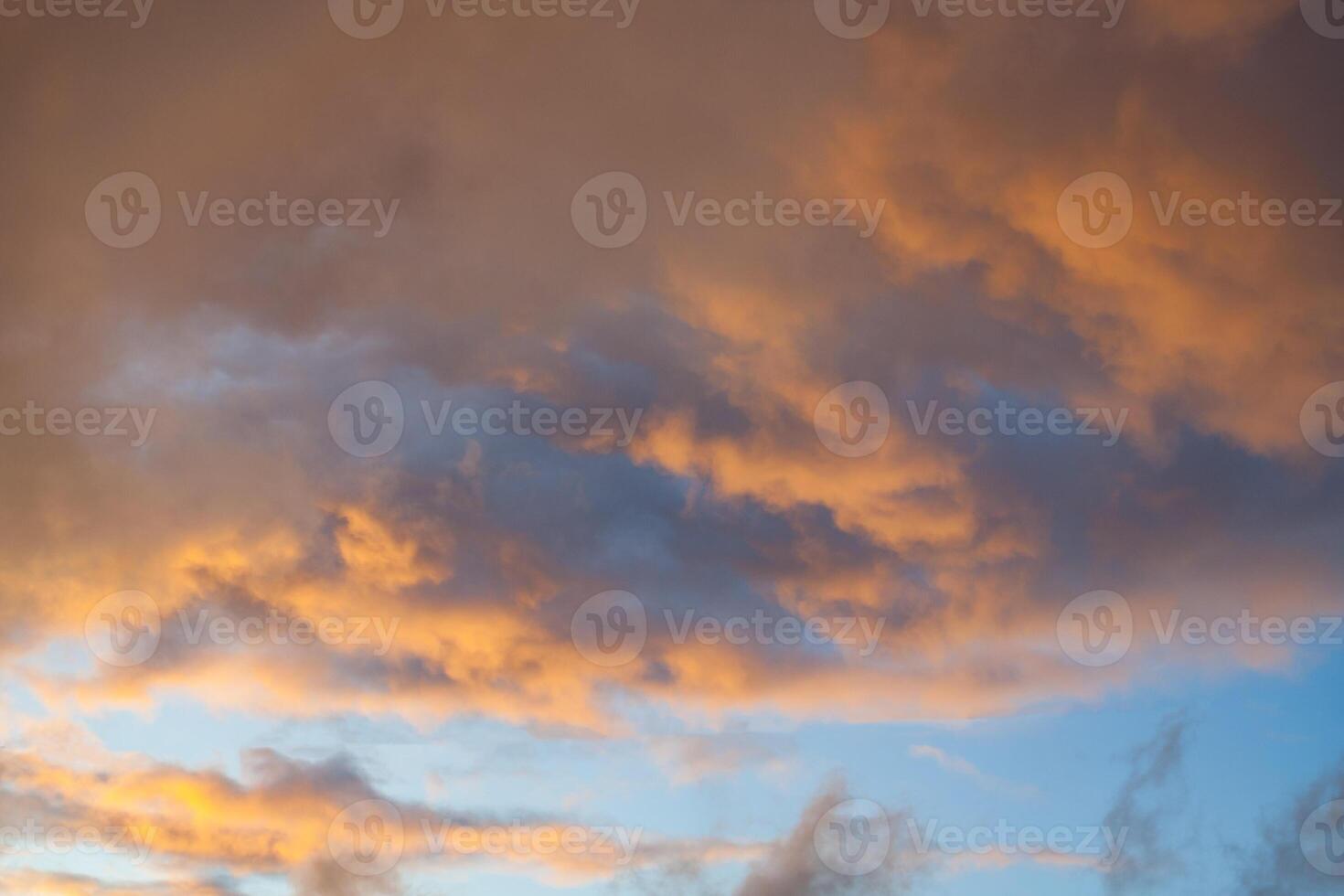 View of dramatic orange sunset clouds photo