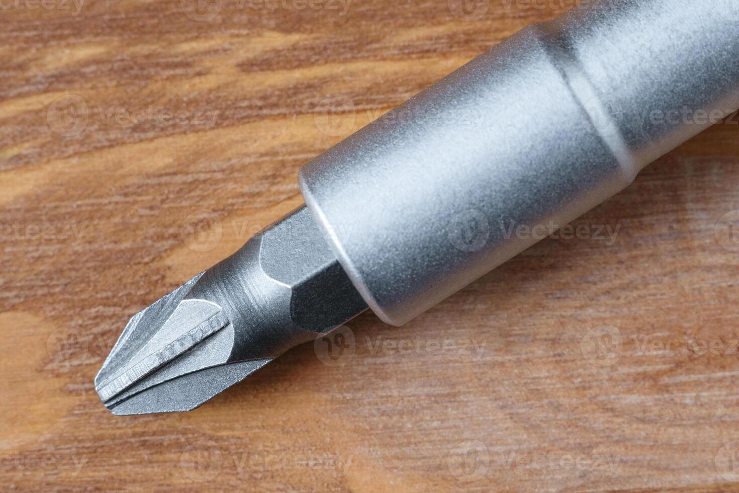 Close up view of a screwdriver on a wooden table photo