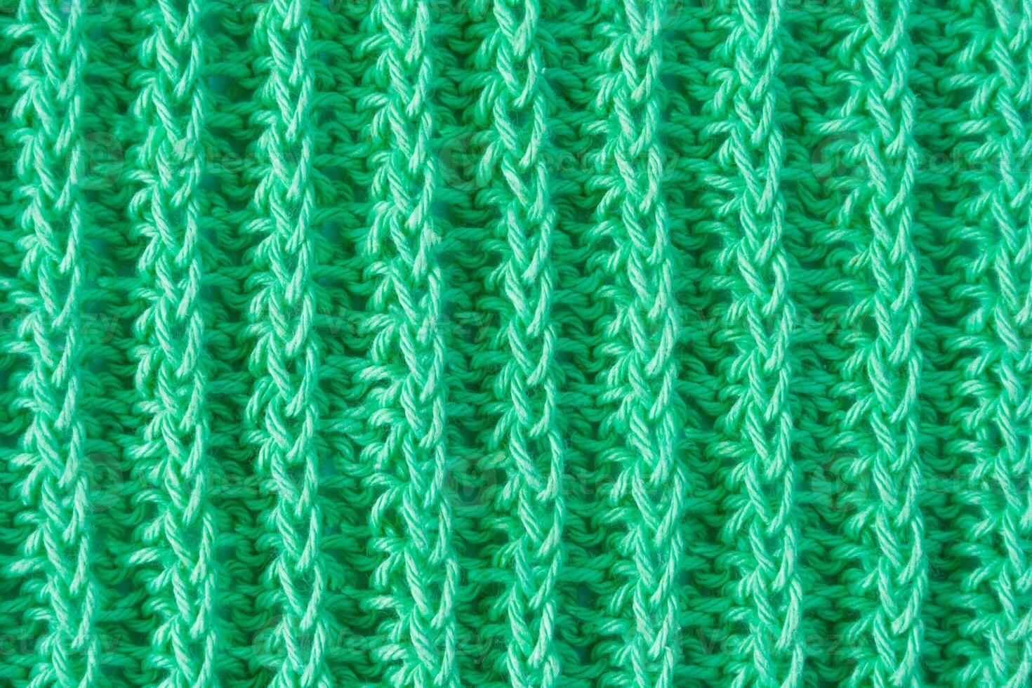 Green cotton yarn as texture as background, abstract photo