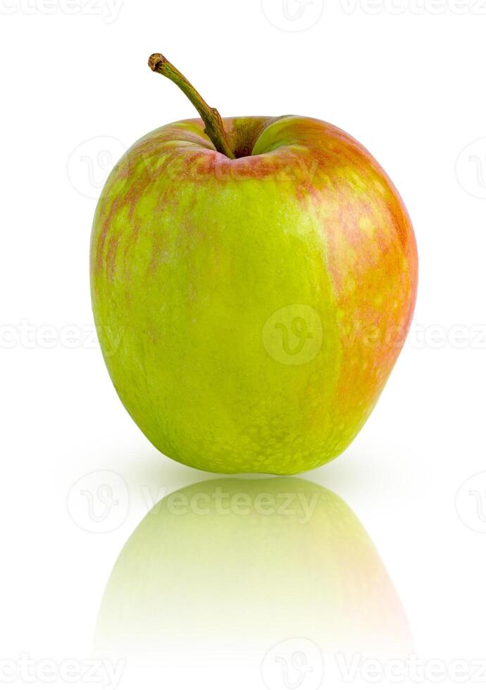 Light green apple with red spots isolated on a white background with mirror reflection photo