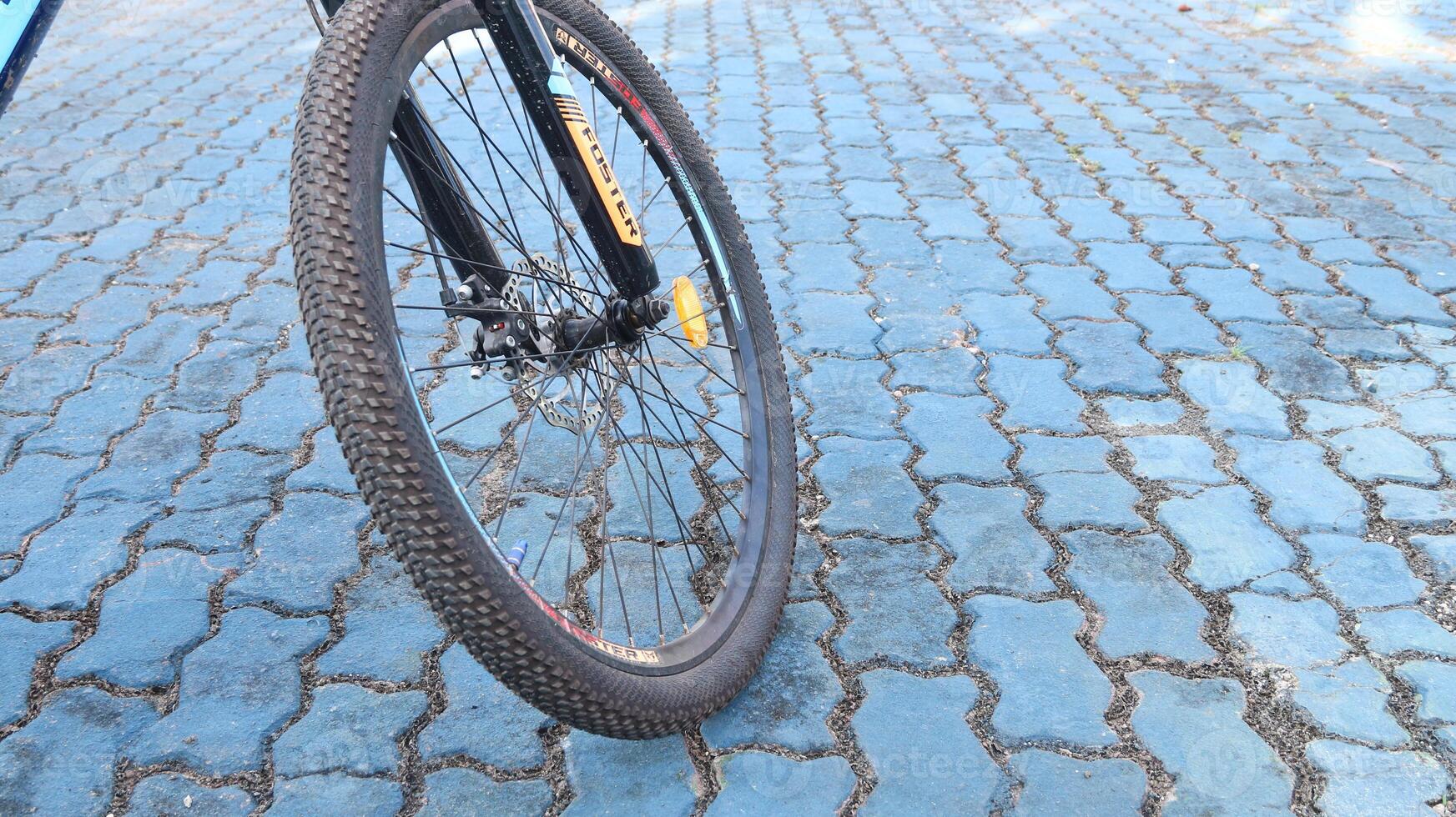 bicycle parked in blue field photo