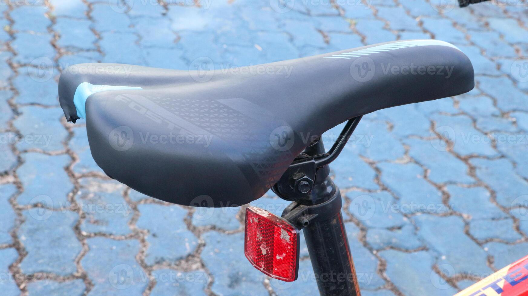 bicycle parked in blue field photo
