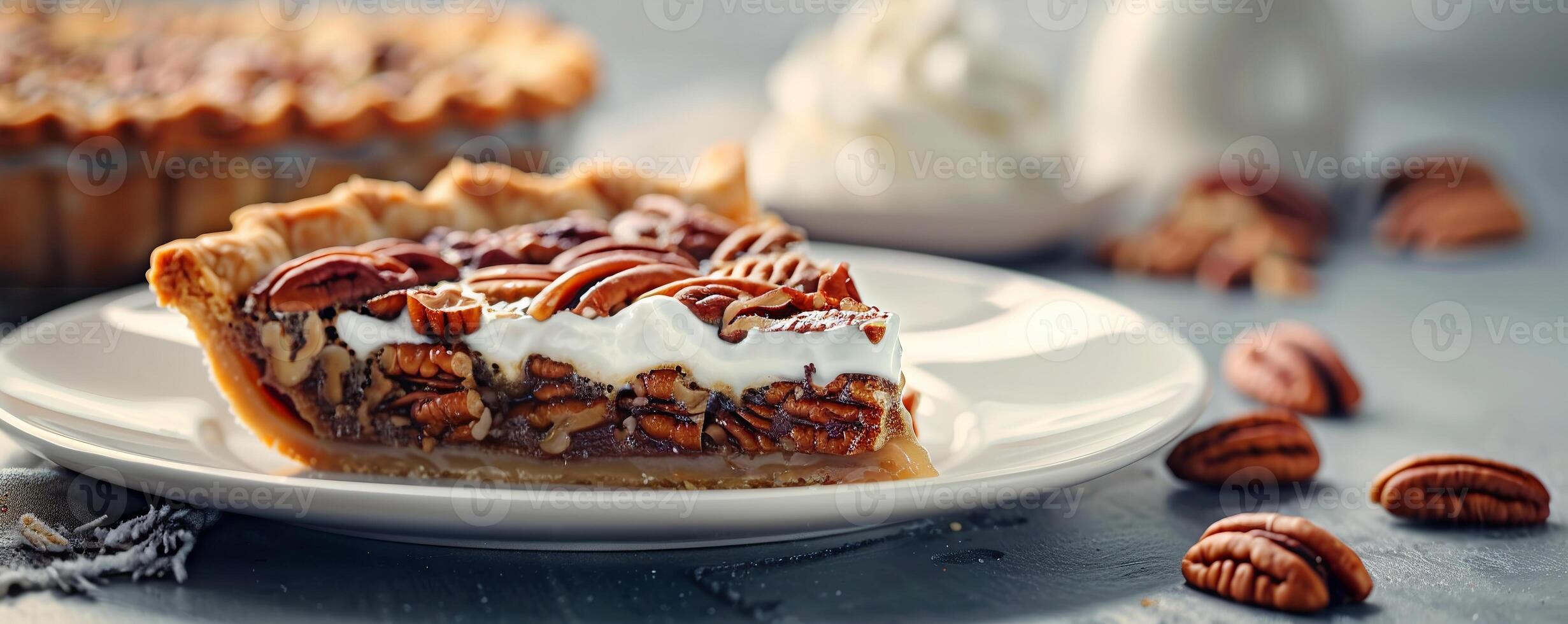 Buttery pecan pie with a golden crust, served with whipped cream. photo