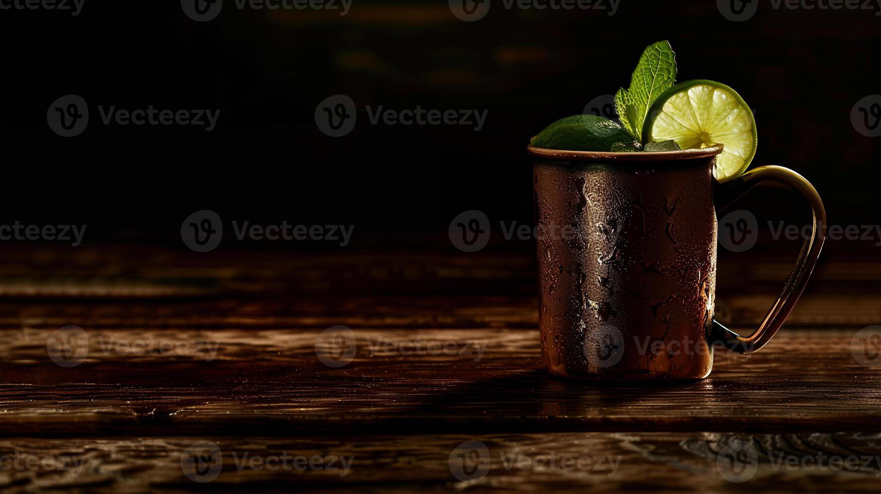 Spicy ginger beer served in a copper mug with a lime wedge and mint sprig. photo
