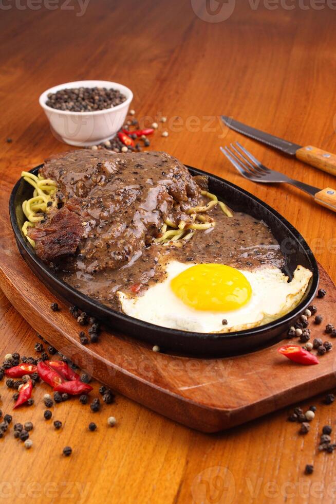 Chicken crispy and egg steak with blackpepper sauce photo