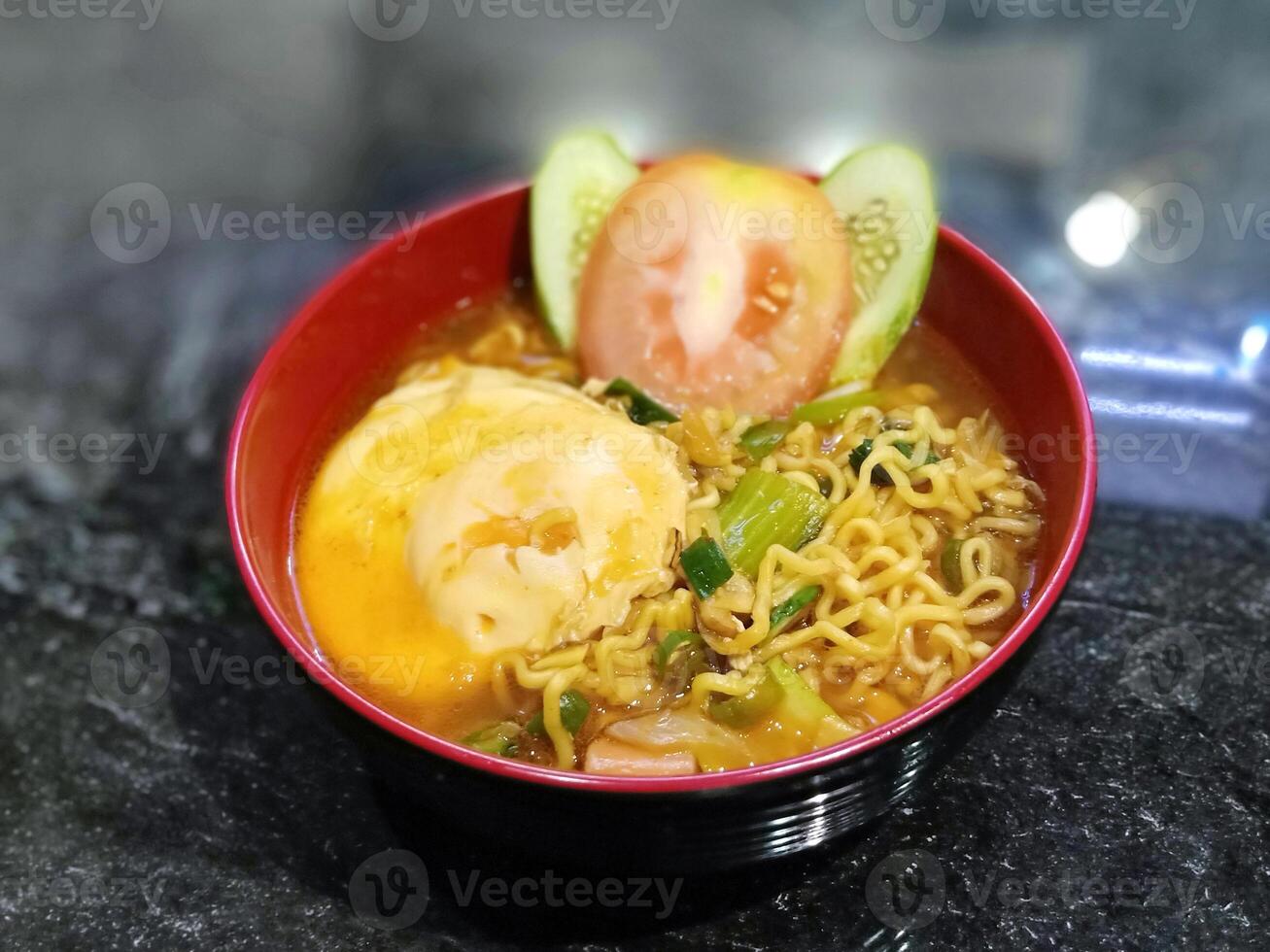 Boiled curry noodles with egg photo