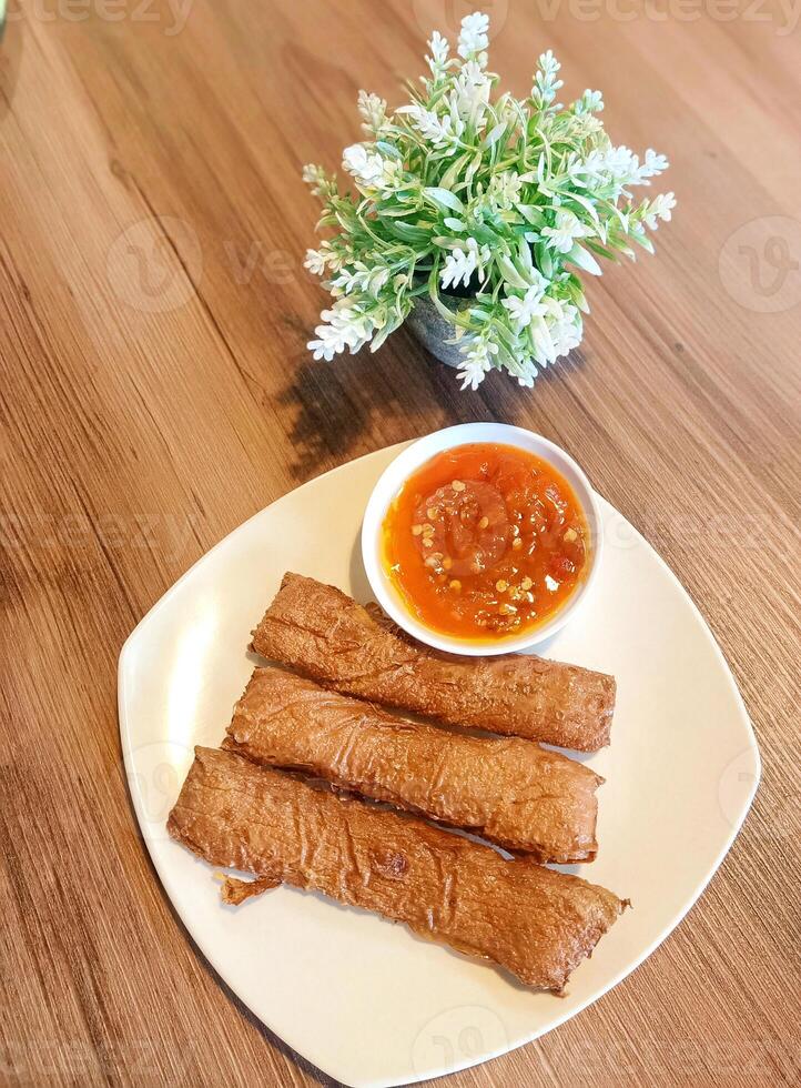 Fish roll with spicy sauce photo