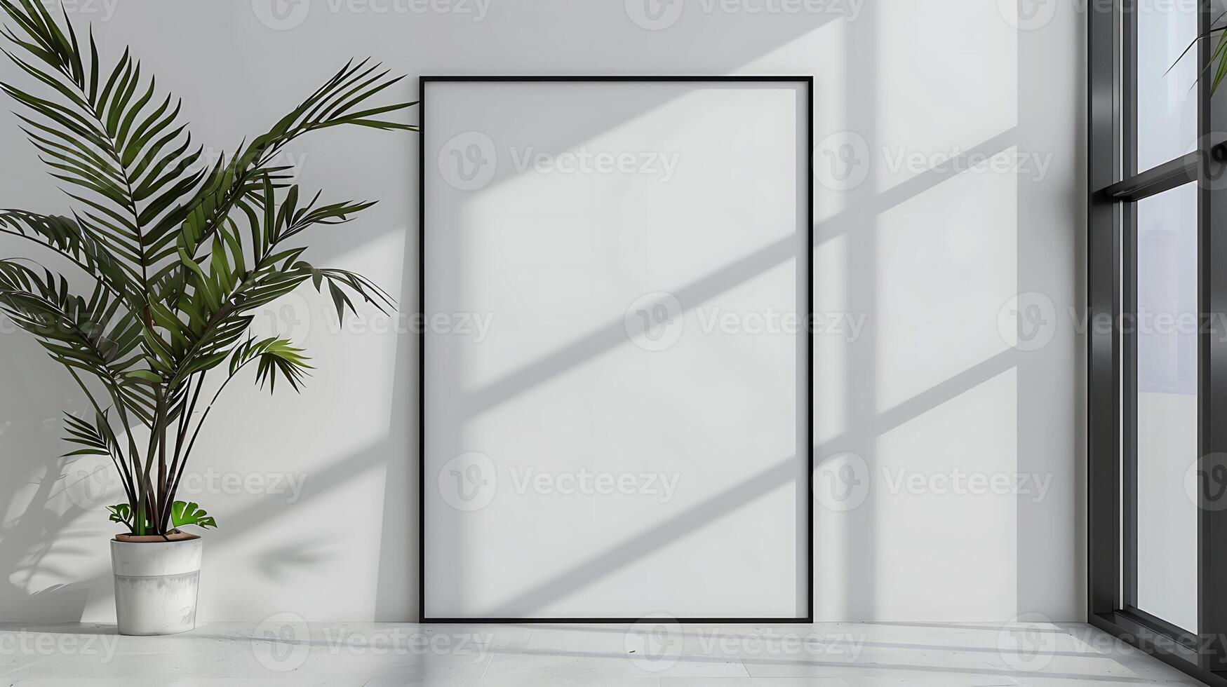 A minimalistic interior with a large blank picture frame leaning against a white wall. A potted plant is placed next to the frame, sunlight streams through a nearby window photo