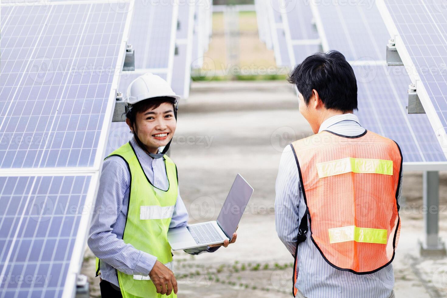 Female electrical engineering team and worker seller install solar photovoltaic panels Clean and environmentally friendly alternative energy Unity and teamwork. photo