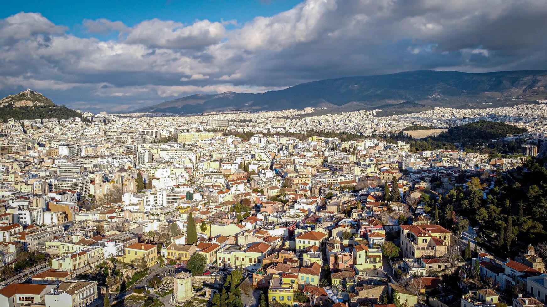 Aerial view of the magnificent city of Athens, capital of Greece. Overpopulation of the metropolis that attracts tourists. High density of populations with clustered houses. Very busy tourist spot photo